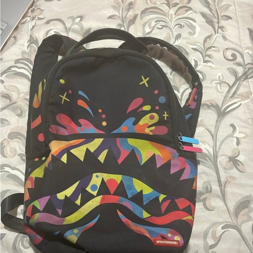 Sprayground Black Backpack with Vibrant Graphic Design